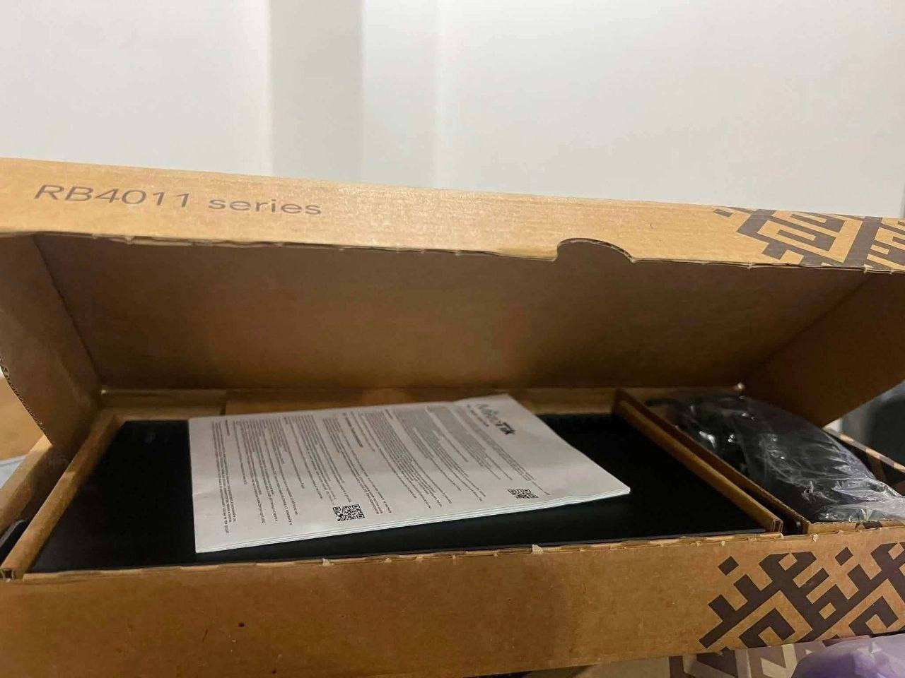 Actual MikroTik RB4011 in its box, supplied by AlekTronix